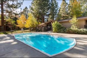 a swimming pool in front of a house at Villa De Los Pinos 15 in Mammoth Lakes