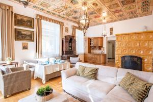 a living room with a couch and a table at Jacuzzi - Riverside - Garden in Kismaros