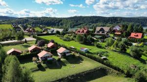 an aerial view of a village with houses and a fence at Domki parterowe ANITA in Zawóz