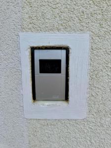 a white outlet on the side of a wall at Appartement Mittagskogel in Velden am Wörthersee