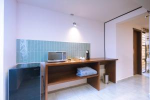 a room with a desk with a computer on it at Reforma 516 in Oaxaca City +34 photos