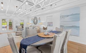 a dining room with a table and chairs at Three Sisters Bungalow in Santa Rosa Beach