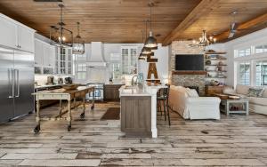 a kitchen and living room with wooden ceilings at Watercolor Reunions in Santa Rosa Beach
