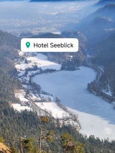 a view of a lake with the words hotel seelibble at Hotel Seeblick in Bad Reichenhall