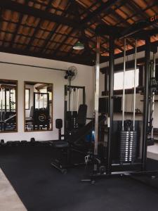 a gym with lots of equipment in a room at Pousada Vila do Beco in Arraial d'Ajuda