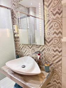 a bathroom with a sink and a mirror at La Casa di Erika in Monasterolo del Castello +29 photos