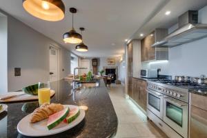 a kitchen with a table with a plate of fruit on it at 4 Bed in Newlyn oc-abcorc in Newlyn