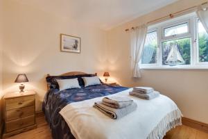 a bedroom with a bed with towels on it at 2 Bed in Staithes oc-wa071 in Staithes