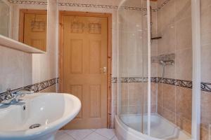 a bathroom with a sink and a tub and a shower at 2 Bed in Staithes oc-wa071 in Staithes +14 photos