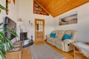a living room with a couch and a fireplace at 2 Bed in Staithes oc-wa071 in Staithes