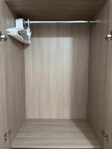 a room with a shower with a light on the ceiling at Arezzo Place Davao in Davao City +9 photos