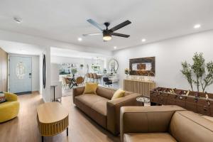 a living room with a couch and a ceiling fan at Private 3BR Home - Hot Tub, Yard, Arcade & Parking in Simi Valley