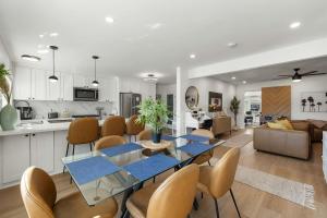 a kitchen and living room with a table and chairs at Private 3BR Home - Hot Tub, Yard, Arcade & Parking in Simi Valley