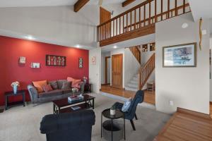 a living room with a couch and a table at Three Lakes Haven - Pacific Retreats in Manson