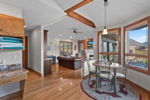 a kitchen and living room with a table and chairs at Three Lakes Haven - Pacific Retreats in Manson