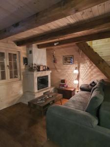 a living room with a couch and a fireplace at Villa Skyline in Kotor