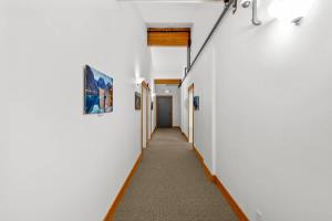a corridor of a hallway with white walls at Klonaqua - Pacific Retreats in Leavenworth
