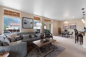 a living room with a couch and a table at Apres Ski Chalet - Pacific Retreats in Leavenworth