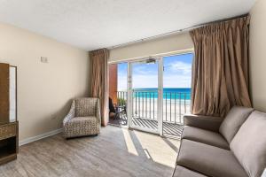 a living room with a view of the ocean at Seahaven Beach Hotel Panama City Beach in Panama City Beach +50 photos