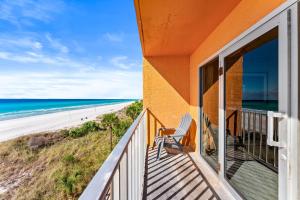 a balcony with a view of the beach at Seahaven Beach Hotel Panama City Beach in Panama City Beach
