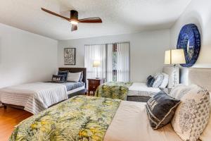 a bedroom with two beds and a ceiling fan at Condo in PGA National Resort w/ Pool & Spa! in Palm Beach Gardens +17 photos