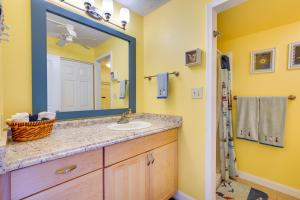 a bathroom with a sink and a mirror at Kailua-Kona Studio - Walk to Hale Halawai Park! in Kailua-Kona +17 photos