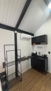 a room with a loft with a table and a shelf at Tiny House Socorro in Socorro +11 photos