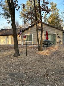 a house with a sign in front of it at KSK Getaway in Nekoosa