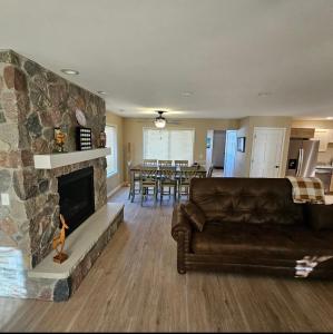 a living room with a couch and a fireplace at KSK Getaway in Nekoosa