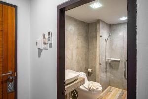 a bathroom with a toilet and a sink and a shower at THT by Thai Hotel Krabi in Krabi +32 photos