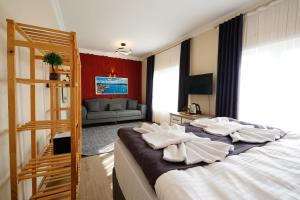 a bedroom with a bed with white pillows on it at The Apartment Galata in Istanbul