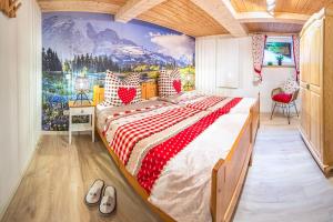 a bedroom with a large bed with a painting on the wall at Bergchalet La Roubine Willingen in Neerdar +30 photos