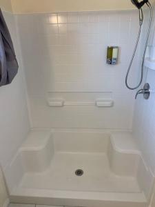 a white bathroom with a tub and a shower at Cozy Villa with Spa, Fireplace, Kitchen, Yard, BBQ in Simi Valley +21 photos