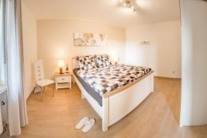 a bedroom with a bed and a chair in it at Chalet La Belle Willingen in Willingen