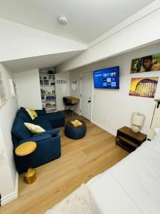 a living room with a couch and a tv at Cozy Villa with Spa, Fireplace, Kitchen, Yard, BBQ in Simi Valley