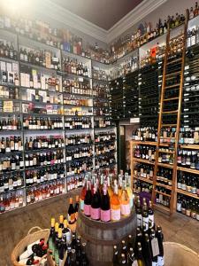 a room filled with lots of bottles of wine at Cheerful and spacious 3 bed home in Clitheroe in Clitheroe +13 photos