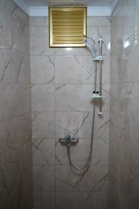 a bathroom with a shower with a shower head at The Apartment Galata in Istanbul +58 photos