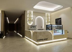 a coffee shop with a counter in a lobby at لمحة للشقق المخدومة in Riyadh