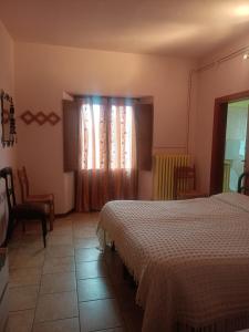 a hotel room with two beds and a window at L'Antica Locanda da Gigino in Corniolo +44 photos