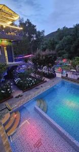 a large swimming pool in front of a building at Top Ourika in Aghbalou +25 photos