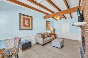 a living room with a couch and a chair at Island Gem B home in Anna Maria