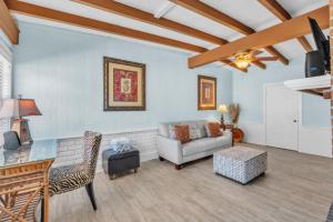 a living room with a couch and a table at Island Gem B home in Anna Maria