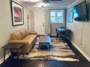 a living room with a couch and a table at The Hourglass Inn- Unit B in Savannah