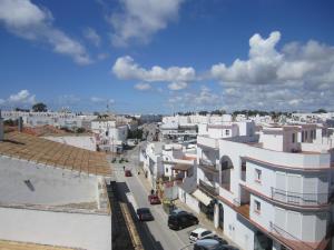 an aerial view of a city with white buildings at Hostal La Conileña in Conil de la Frontera