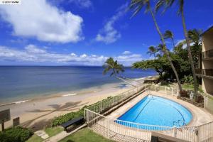 a view of the beach from the balcony of a condo at Stunning 2BD 2BA Ocean Front Condo Great View, AC in Wailuku