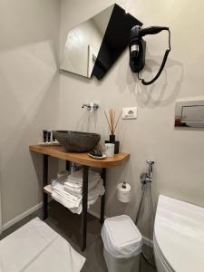 a bathroom with a sink and a toilet at Oblò Portovenere Guesthouse in Portovenere