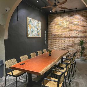 a conference room with a wooden table and chairs at A6886 Swimming Pool Villa in Kuantan