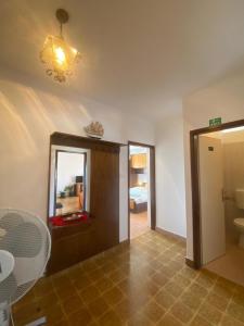a room with a bathroom with a mirror and a sink at Apartments Verdea in Kampor +35 photos