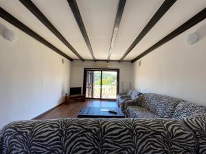 a living room with a couch and a window at Apartment Solara in Kampor