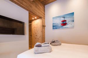 a room with a bed and a ski lift at Luxury Chalet with Private Spa & Wellness Area in Megève +87 photos